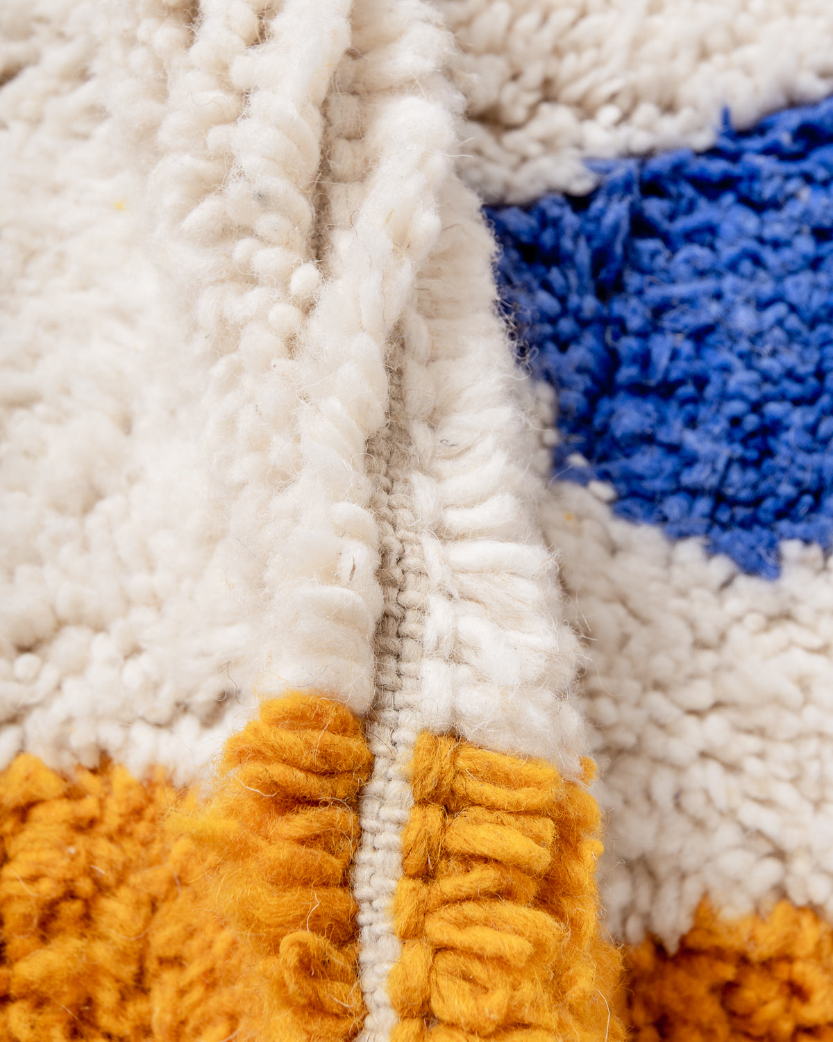 Modern, designer, handcrafted Berber rug from Morocco. Beniourain carpet with beautiful colours and patterns and fluffy wool texture.